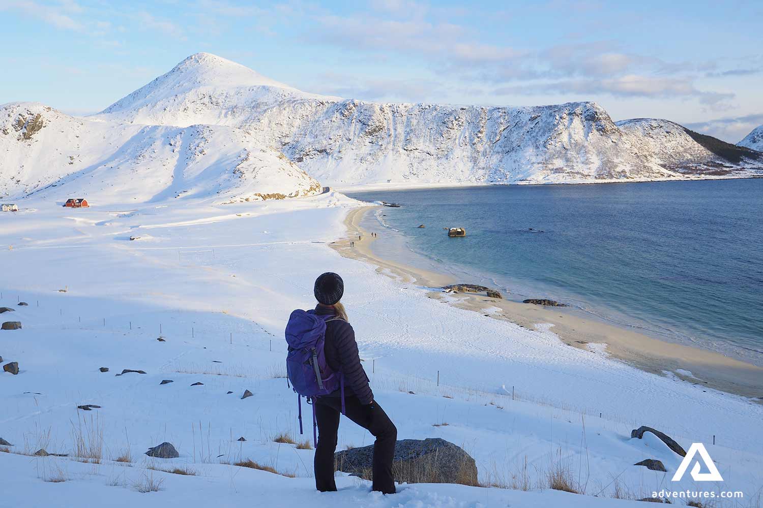 woman hiking haukland beach in norway