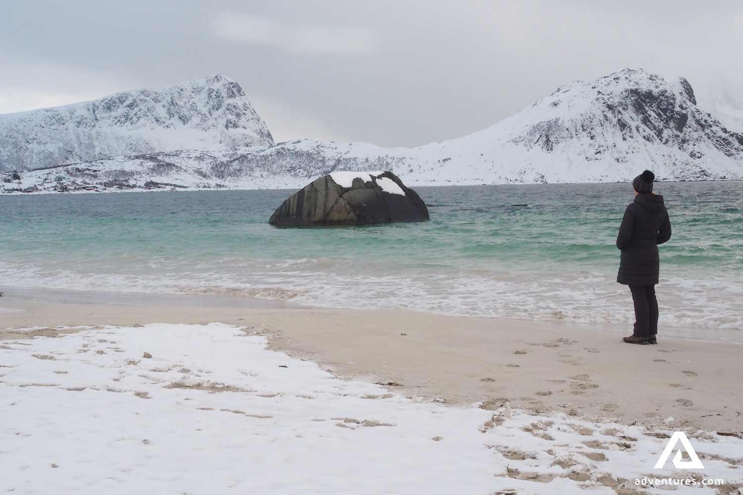 woman sightseeing haukland beach in norway