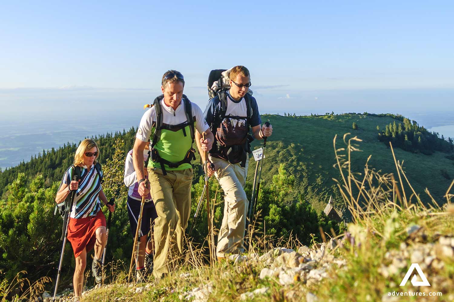 friends hiking in norway mountains at summer