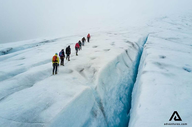 people hiking on svartisen glacier in norway