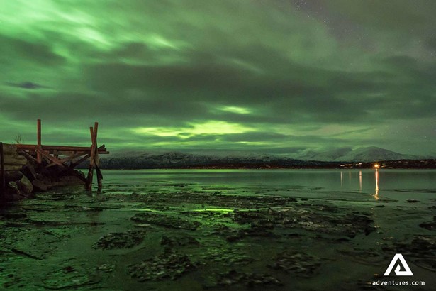 seaside view with northern lights in abisko