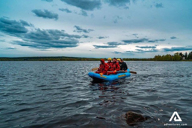 group rafting in a lake of finland