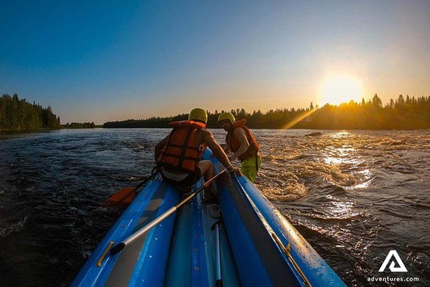 people rafting by the sundown in finland