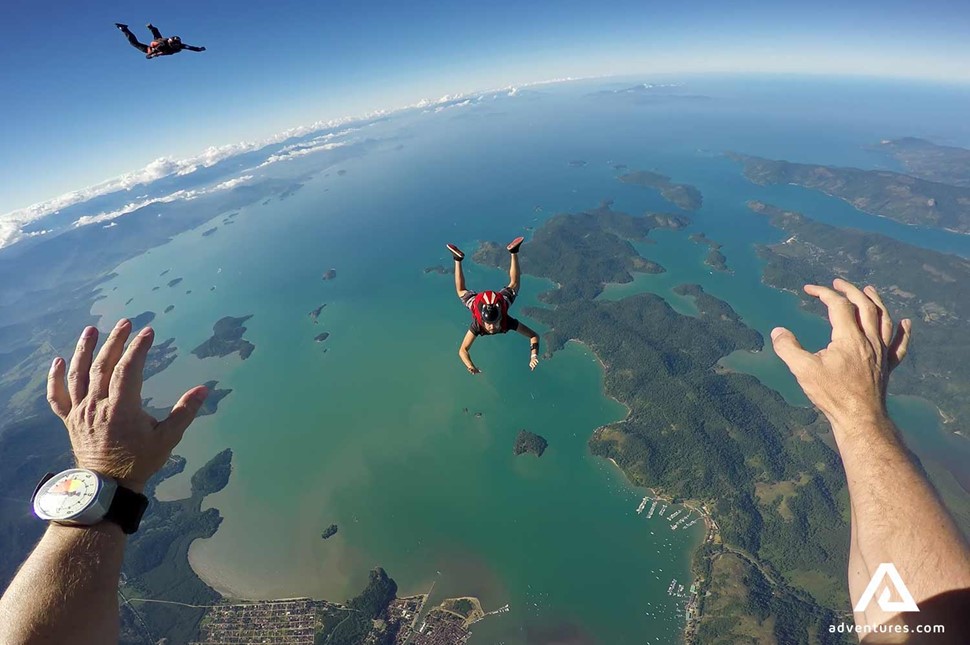 first person view while skydiving above a sea