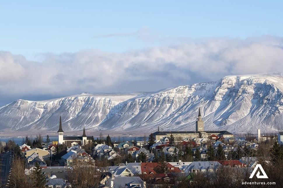 Reykjavik city near enormous mountain