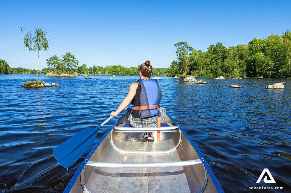 Woman Lake Canoeing in Sweden