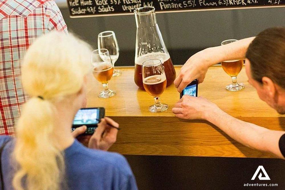 people taking pictures of beer