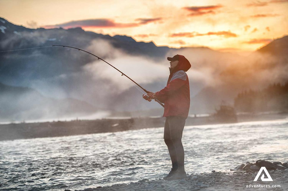 Fishing Man Near Foggy Lake in Canada