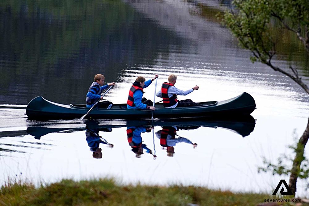 three children canoeing