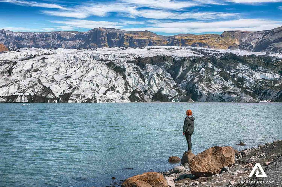 woman exploring glacier lagoon in Iceland