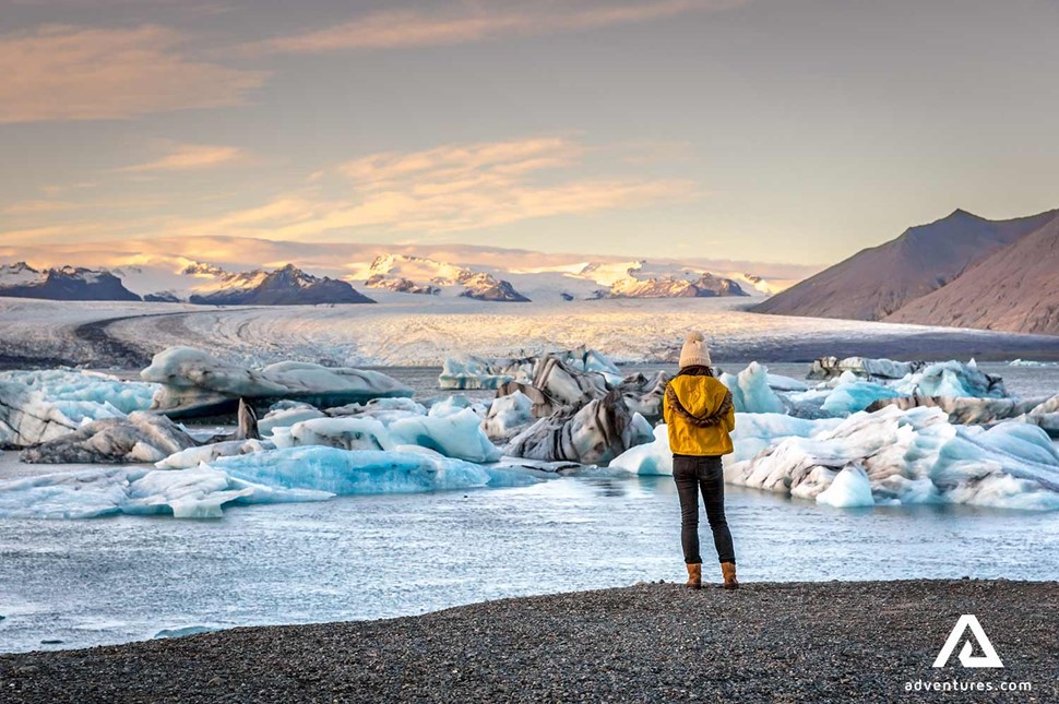woman explores Jokulsarlon Glacier Lagoon in Iceland