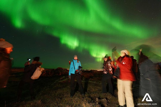 people taking pictures of Northern Lights