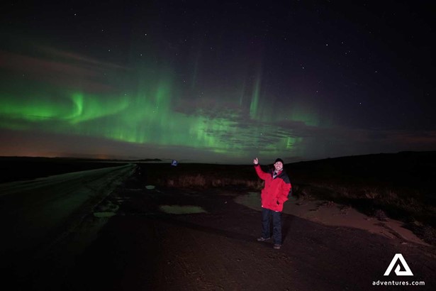 excited man watching Northern Lights