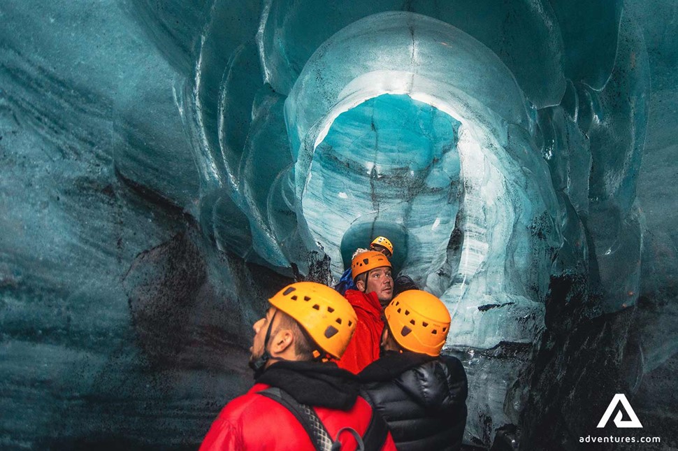 Group of People Exploring Katla Ice Cave in Iceland