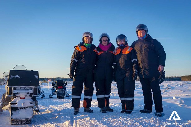 small group snowmobiling tour in Lapland