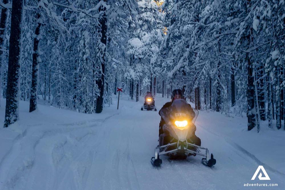 snowmobiling in evening
