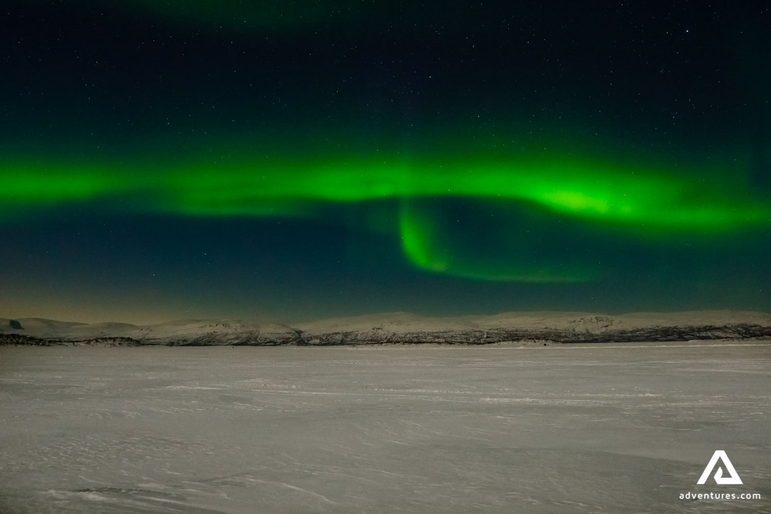 Northern lights above the mountain range