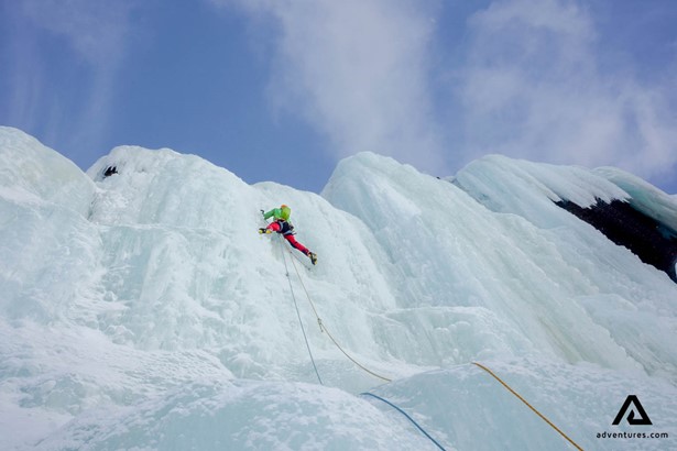woman climbing on ice crevasses
