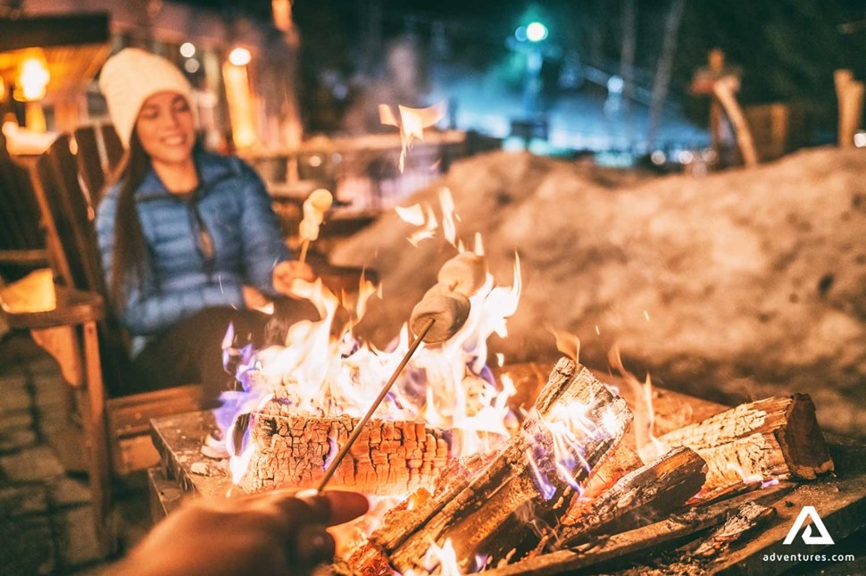 people roasting marshmallows on fire