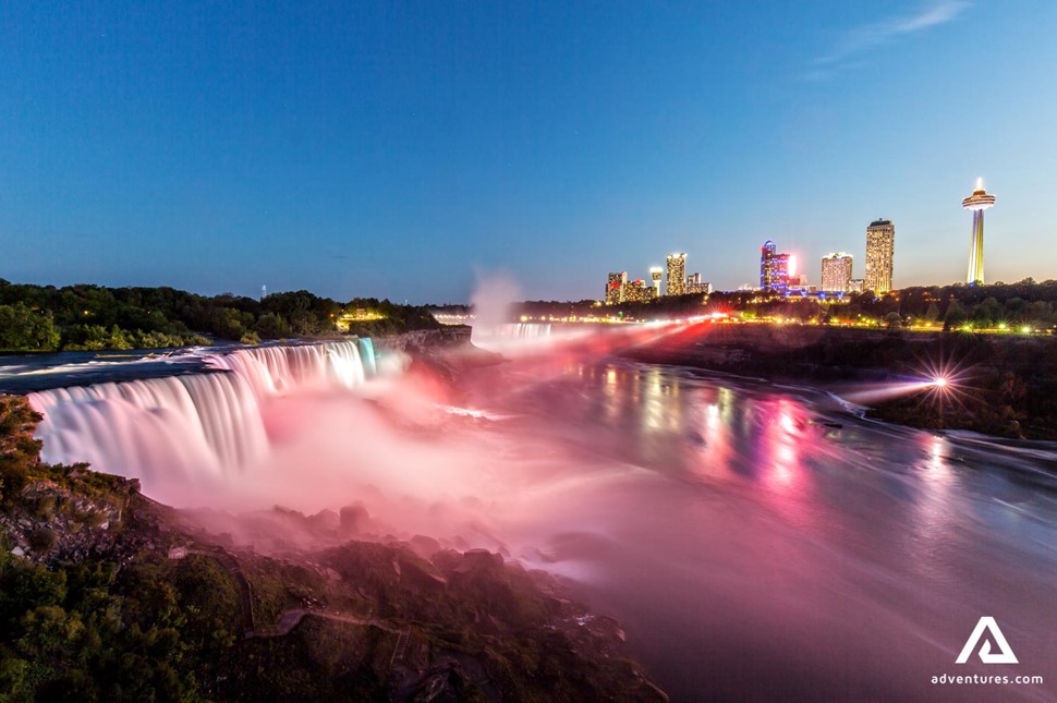 lighted up Niagara falls at night