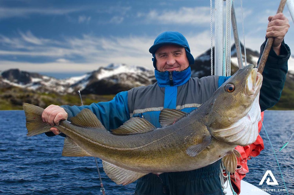 Happy fisherman posing in Norway