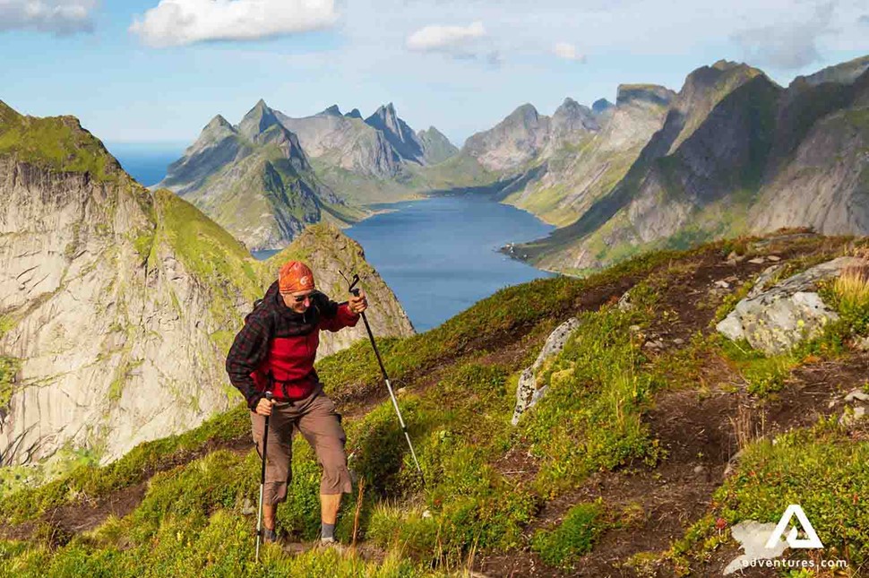 Man hiking in the mountains of Lofoten Islands