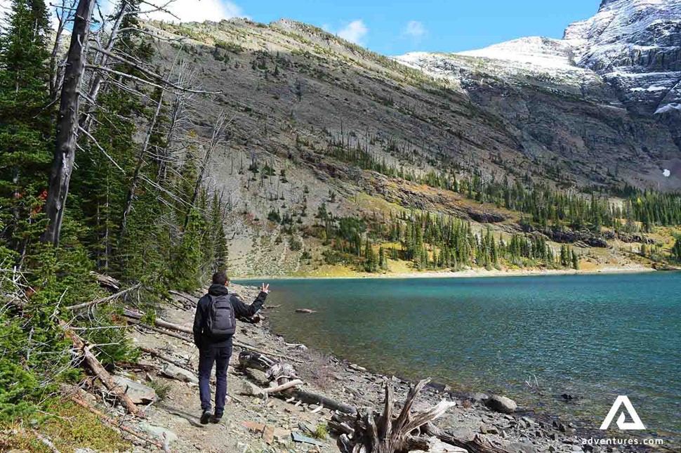 Man hiking by Waterton lake in Canada