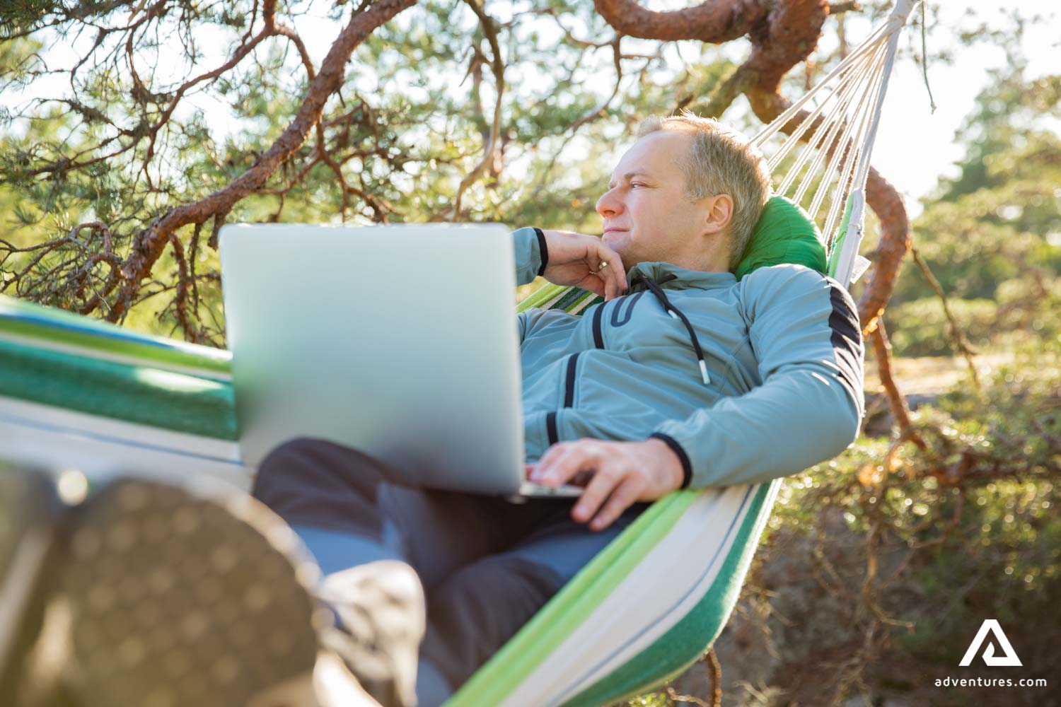 man laying in a hammock in finland