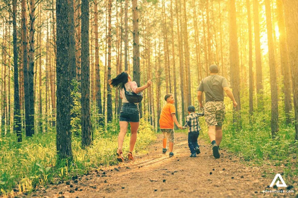happy family exploring the finnish forest