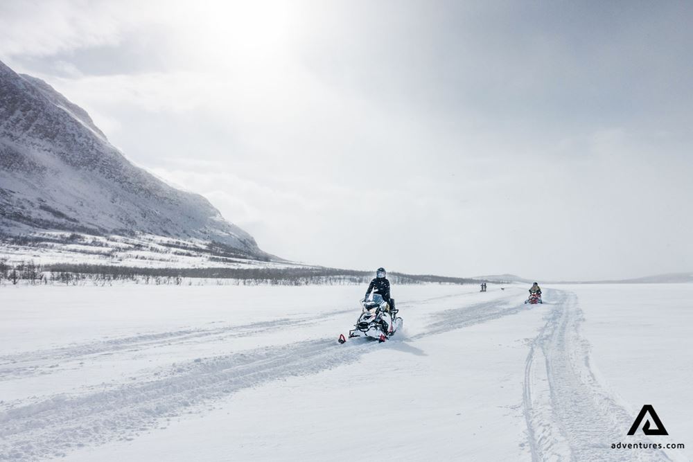 Driving snowmobiles in Lapland
