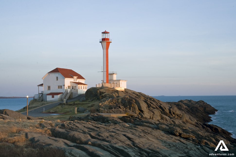 Cape Forchu Lighthouse by the shore in Yarmouth