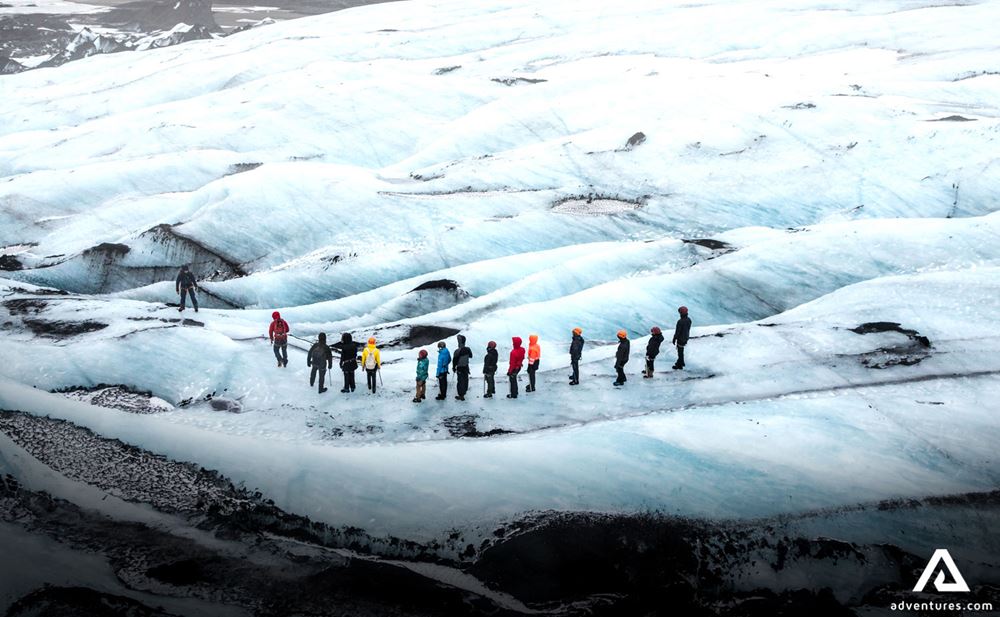 Small group walking on glacier