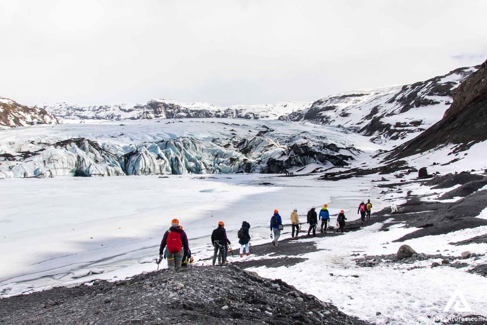 Group walking towards glacier