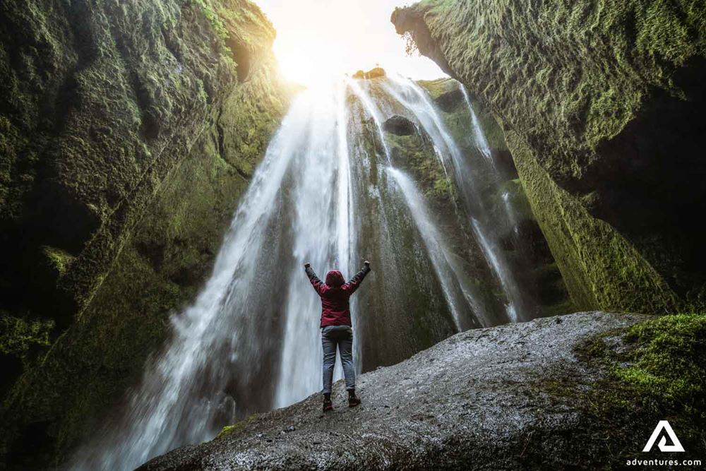 Man Exploring Gljufrabui Waterfall