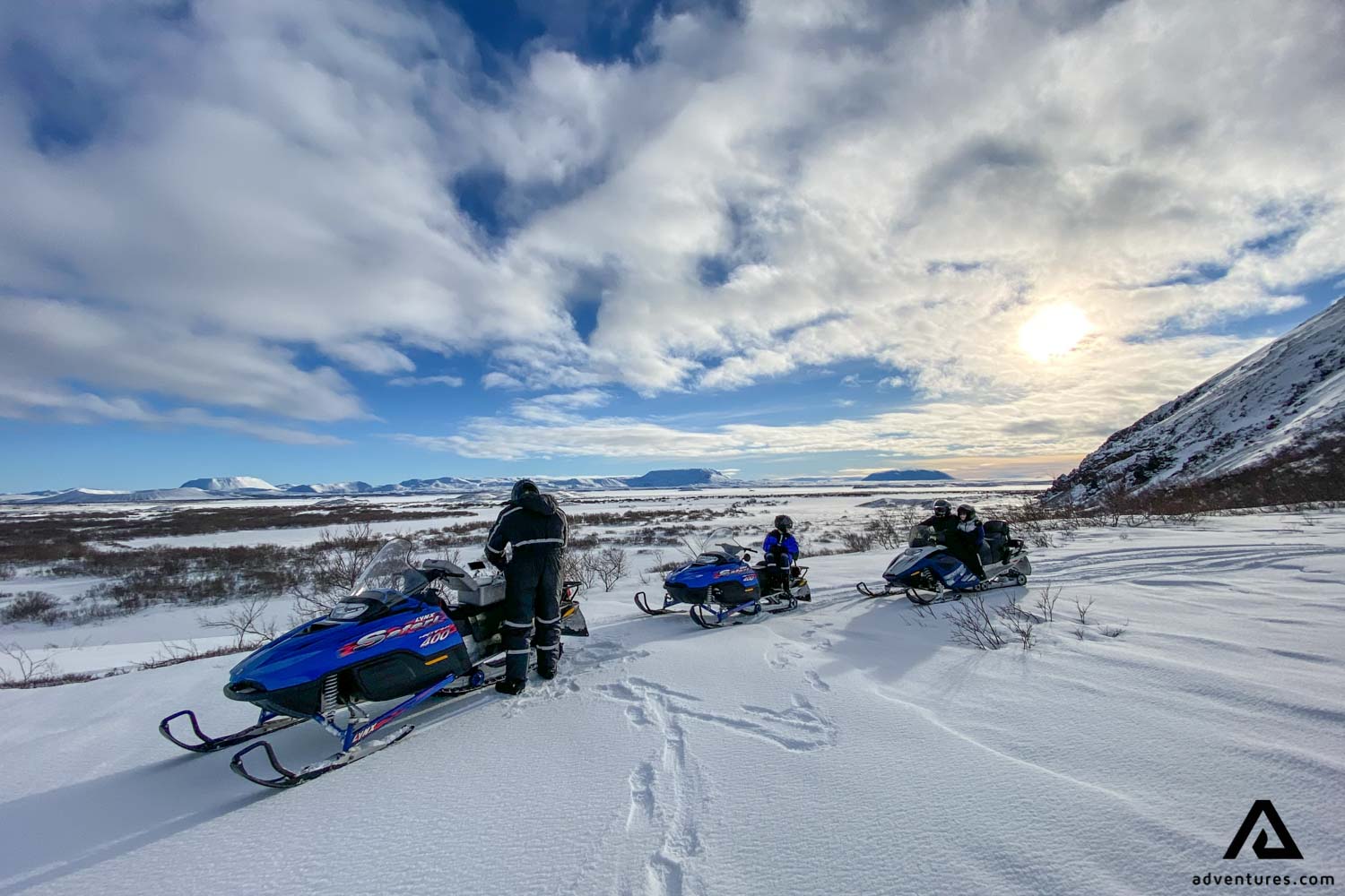 People Getting Ready for Snowmobiling