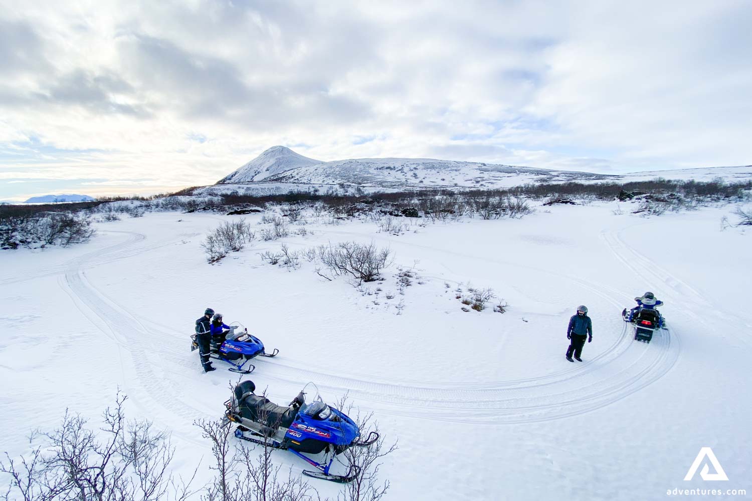 People Practice Snowmobiling