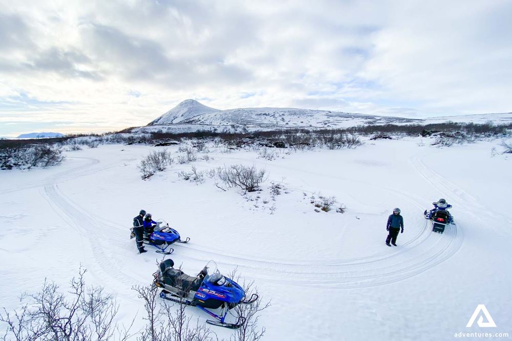 People Practice Snowmobiling
