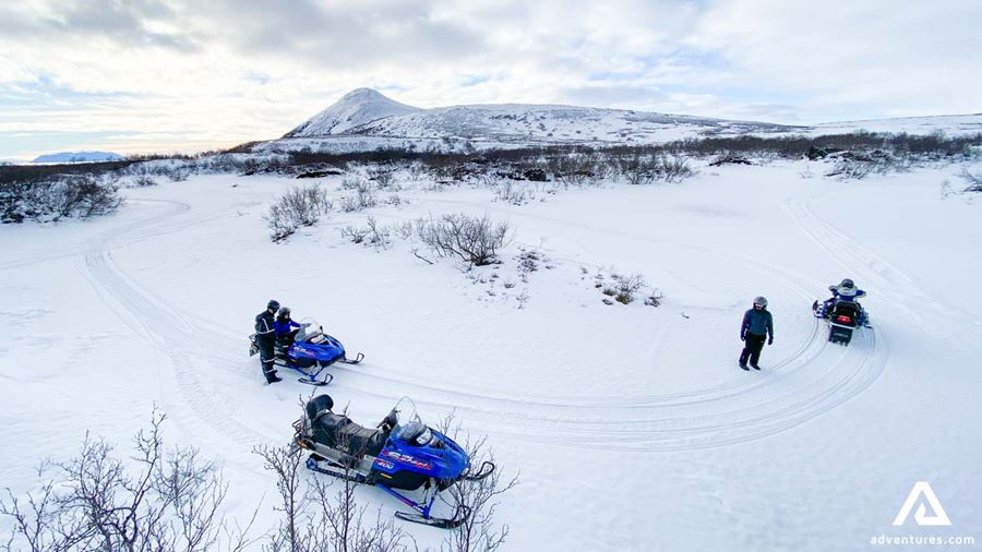 People Practice Snowmobiling