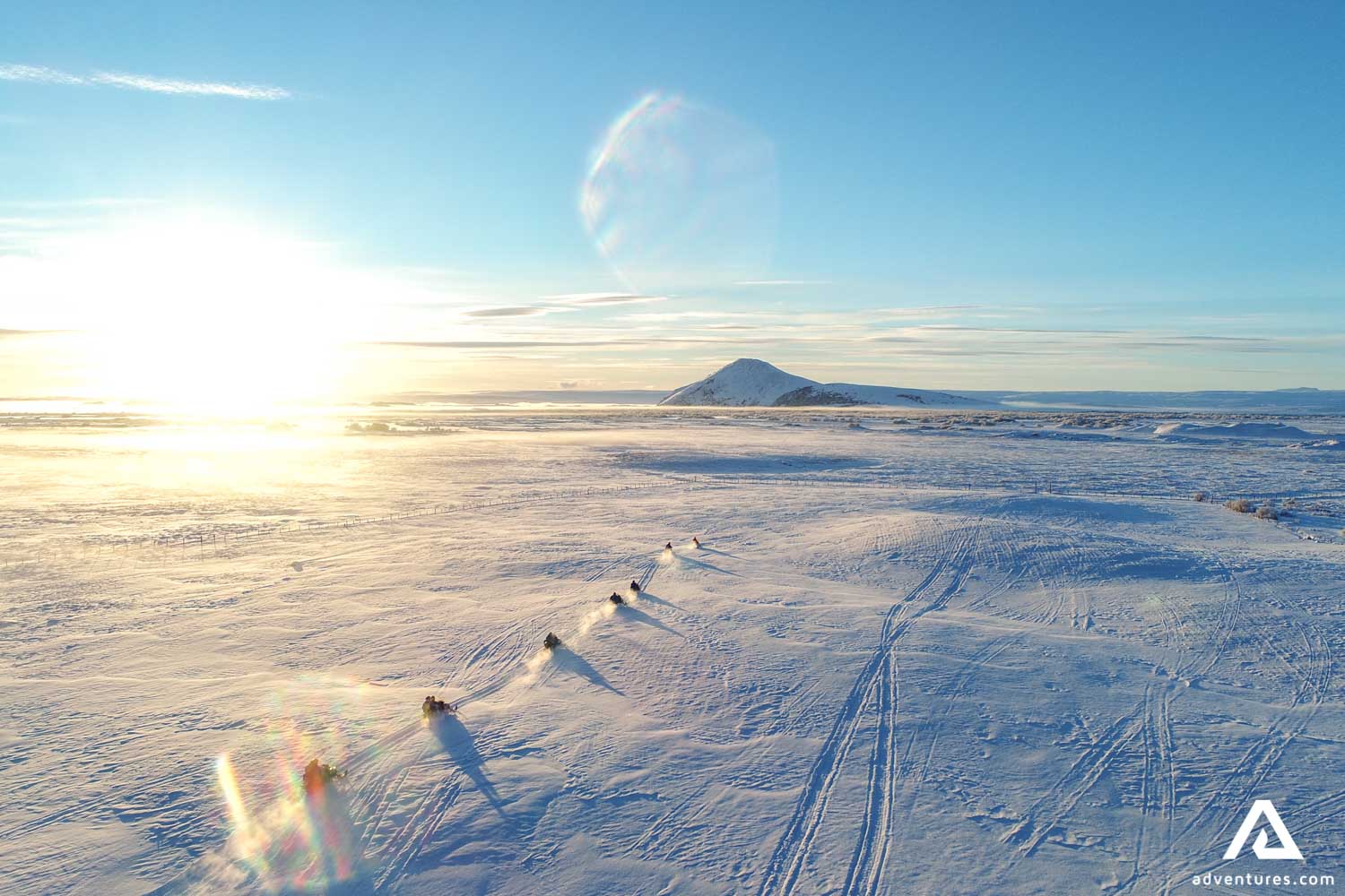 Snowmobiling on Frozen Lake in Iceland