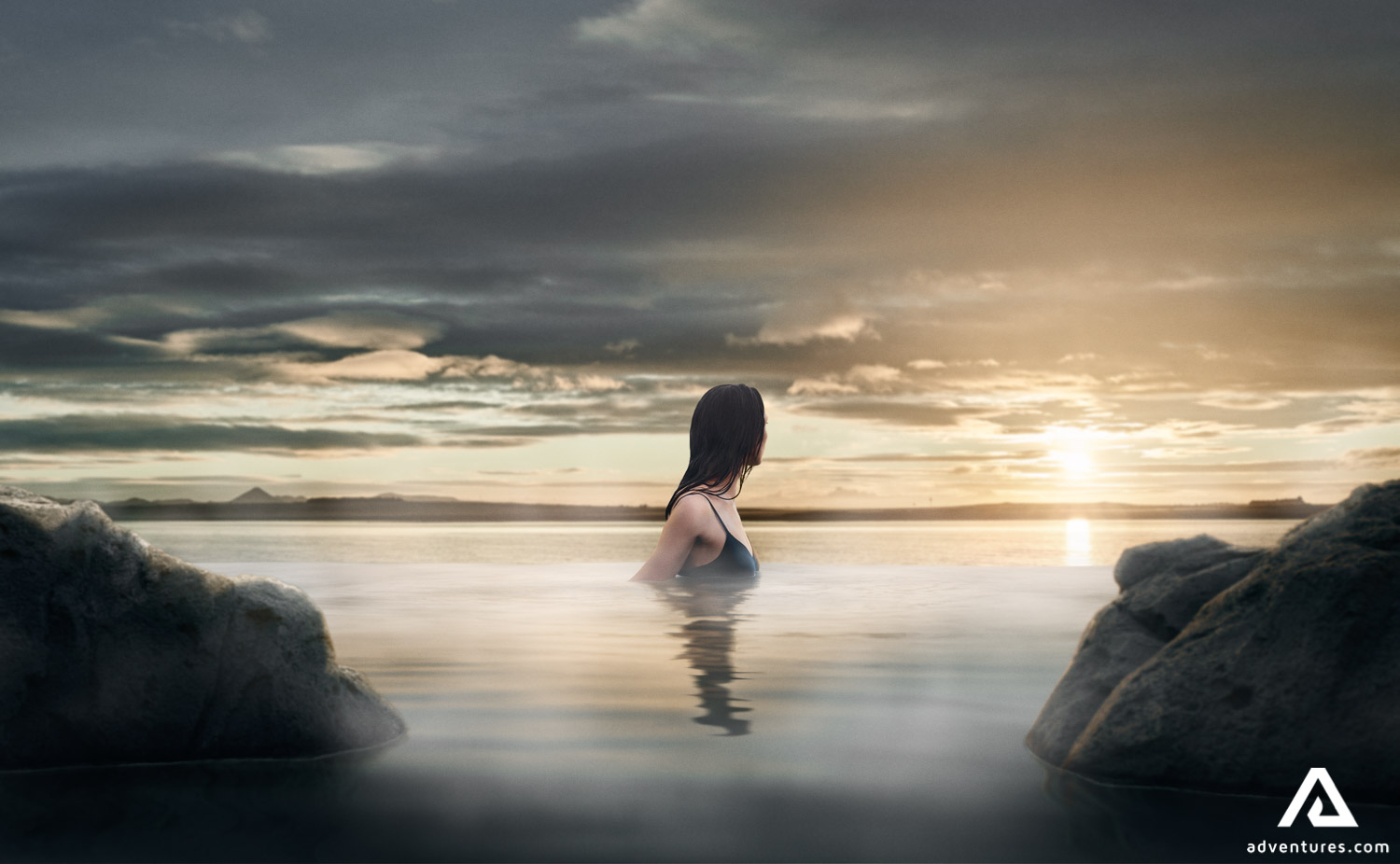 Woman Enjoys Sunset at Sky Lagoon in Iceland