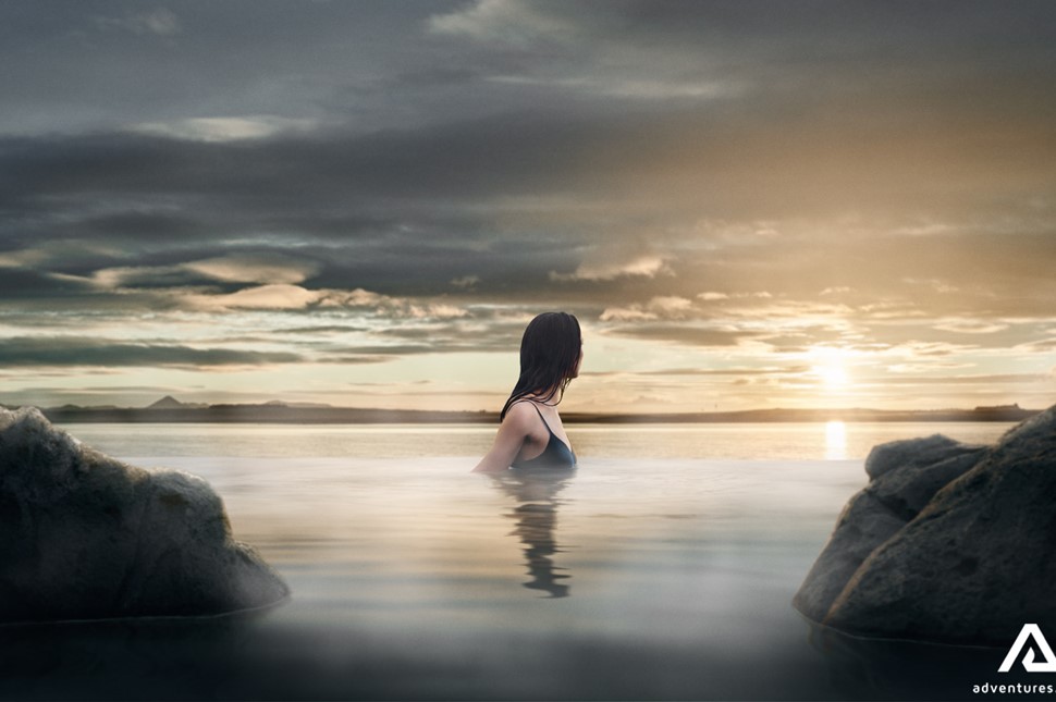 Woman Enjoys Sunset at Sky Lagoon in Iceland
