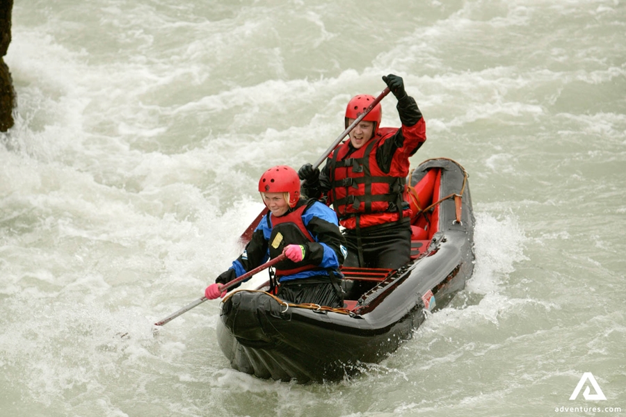 Couple Kayaking in River