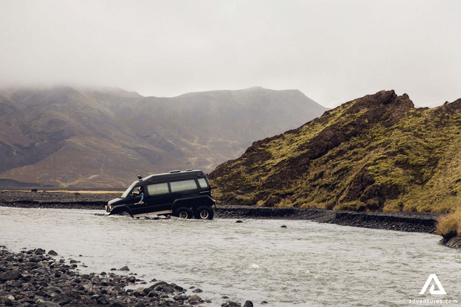 Black Super Jeep Driving into River
