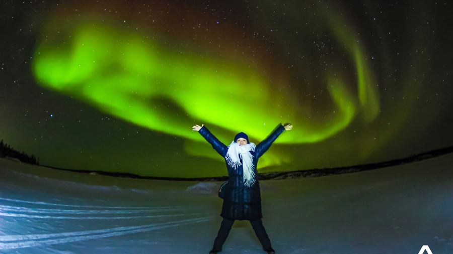 Excited Woman and Northern Lights