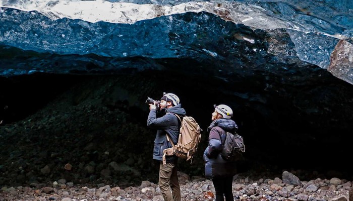 Photographer in Icelandic Ice Cave