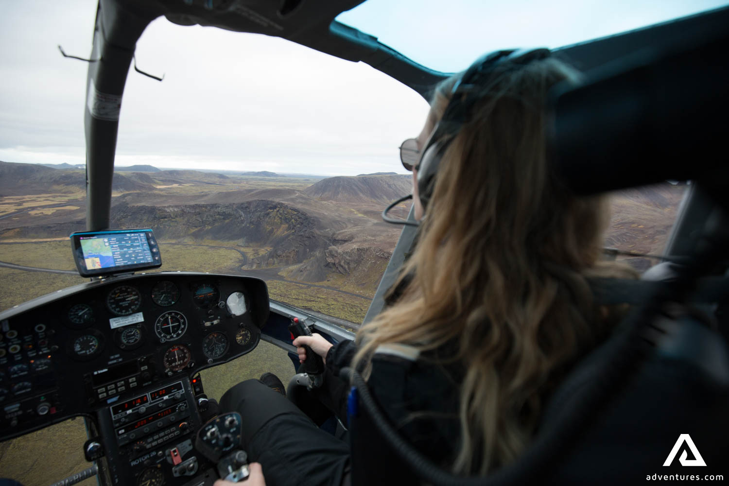 Woman Pilot Flying Helicopter in Iceland