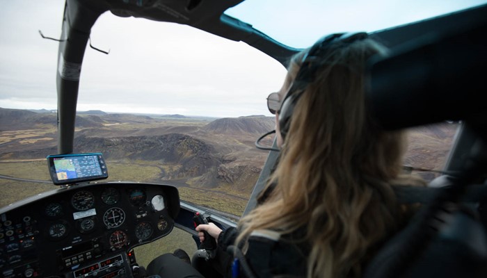 Woman Pilot Flying Helicopter in Iceland