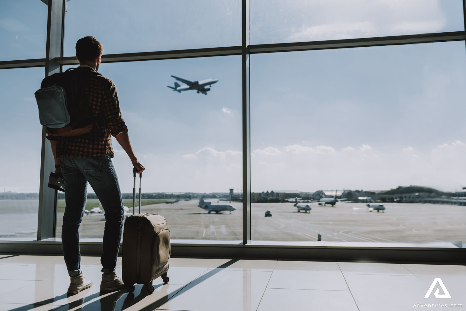 Man in Airport Waiting for Flight