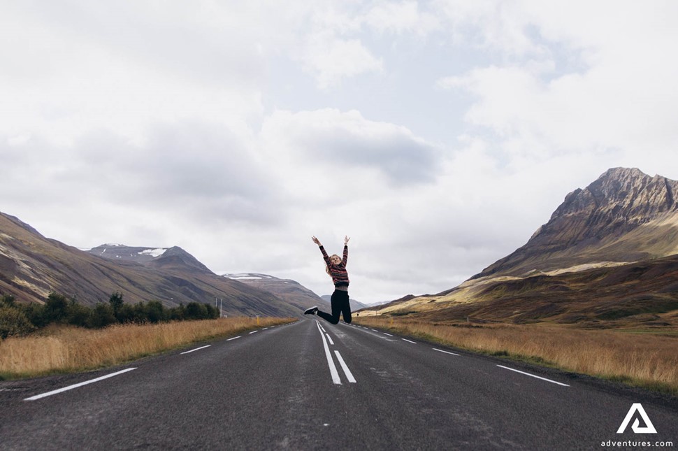 Woman Posing for Picture on Icelandic Road