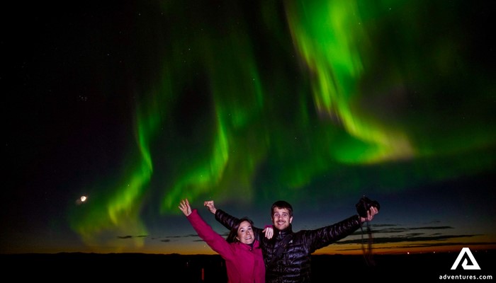 Excited Couple Watching Auroras in Iceland